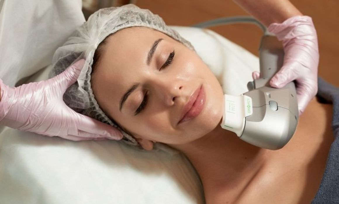 Closeup of woman receiving a HIFU treatment in clinic